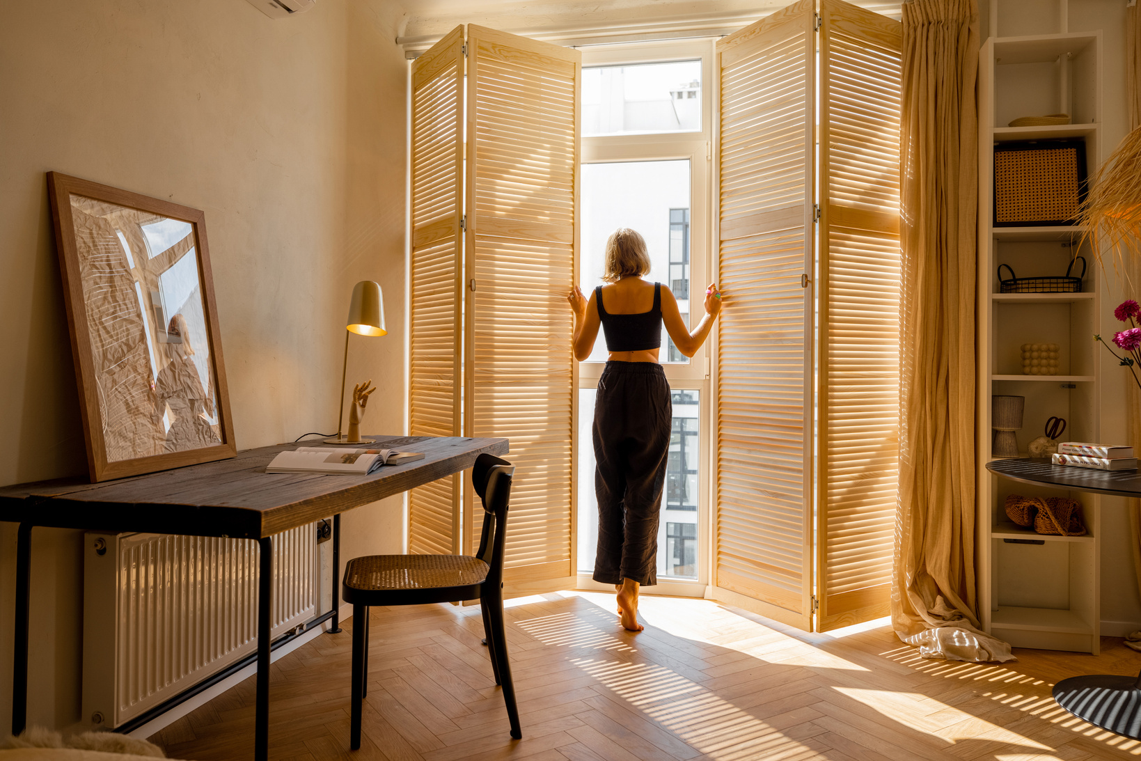 Person Opens Window Blinds at Sunny Room